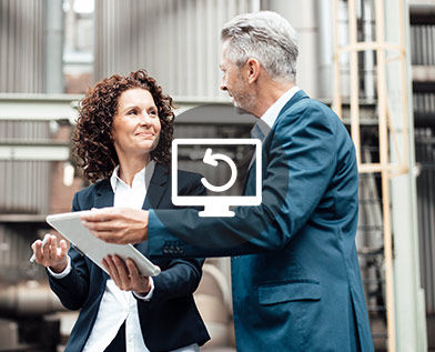 Business woman using tablet while discussing