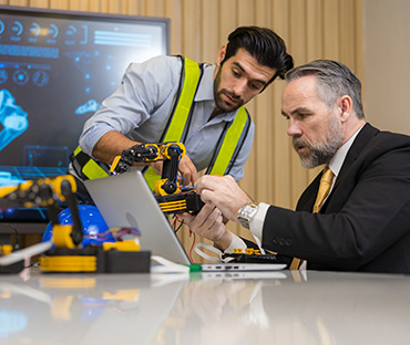 Engineering team have discussion the robotic arm prototype